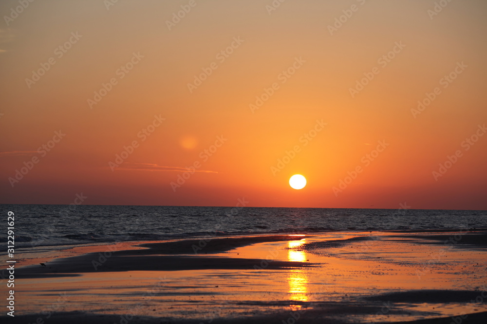 orange sky at sunset with reflection on beach shore #1 orange sky at sunset with reflection on beach shore #1