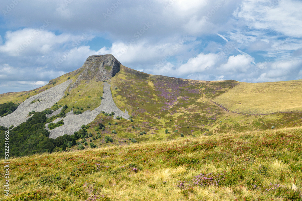 Beautiful viewpoint on a green mountain landscape with volcanic mountain