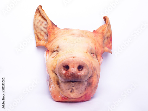 chopped pork head on white background. pork meat concept isolated close-up
