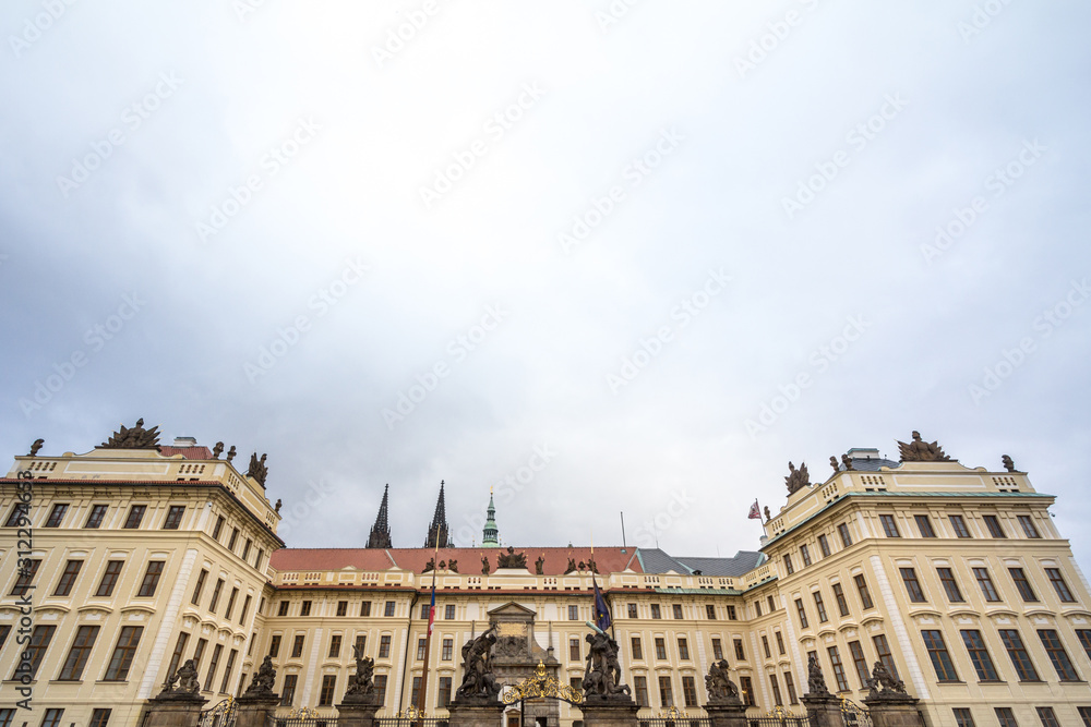 Nove Kralovsky Palac or New Royal Palace in Prague Castle (Prazsky Hrad), seen from its main gate, with its statues of the Wrestling giants, also called sousosi souboj titanu, a landmark of  Prague