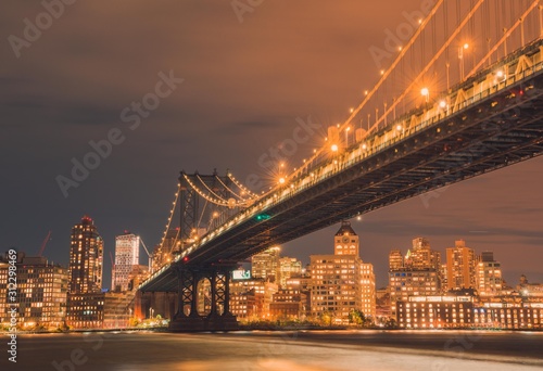 Fototapeta Naklejka Na Ścianę i Meble -  bridge night city new york manhattan brooklyn skyline architecture dumbo sea cityscape building dusk sunset