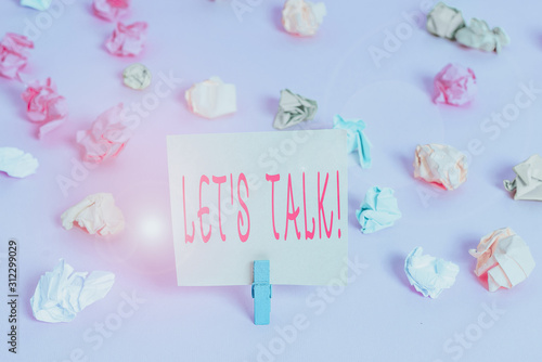 Writing note showing Let S Talk. Business concept for they are suggesting beginning conversation on specific topic Colored crumpled papers empty reminder pink floor background clothespin