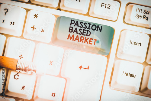 Writing note showing Passion Based Market. Business concept for Emotional Sales Channel a Personalize centric Strategy White pc keyboard with note paper above the white background photo