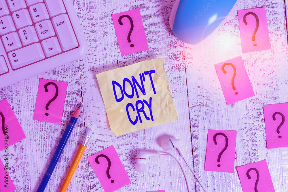 Word writing text Don T Cry. Business photo showcasing Shed tears typically as an expression of distress pain or sorrow Writing tools, computer stuff and scribbled paper on top of wooden table Word writing text Don T Cry. Business photo showcasing Shed tears typically as an expression of distress pain or sorrow Writing tools, computer stuff and scribbled paper on top of wooden table
