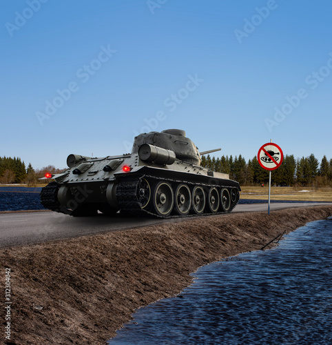 Quadro em tela A funny image of a tank having stopped before the no tanks traffic sign with t