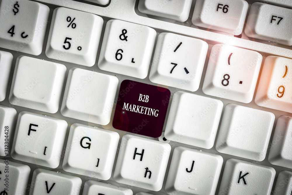 Text sign showing B2B Marketing. Business photo text Partnership Companies Supply Chain Merger Leads Resell White pc keyboard with empty note paper above white background key copy space Text sign showing B2B Marketing. Business photo text Partnership Companies Supply Chain Merger Leads Resell White pc keyboard with empty note paper above white background key copy space
