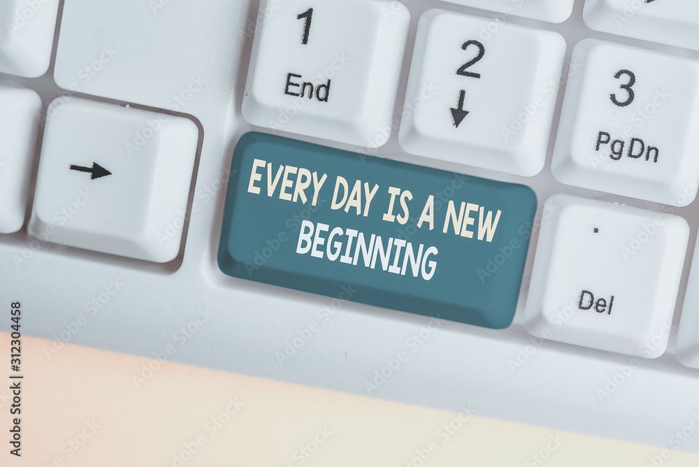 Conceptual hand writing showing Every Day Is A New Beginning. Concept meaning you have a chance to dream work live better White pc keyboard with note paper above the white background Conceptual hand writing showing Every Day Is A New Beginning. Concept meaning you have a chance to dream work live better White pc keyboard with note paper above the white background