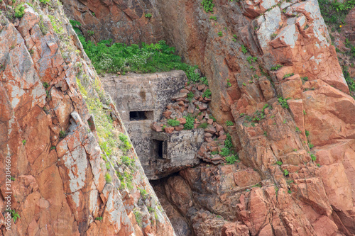 The firing point (DOT) of the Second World War on the rocks of the Russian island in Vladivostok.