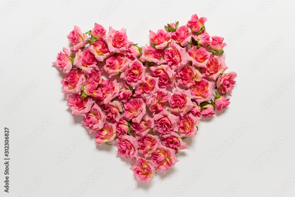 Romantic Valentines day greeting card with heart made of pink roses on white backgound. Romantic Valentines day greeting card with heart made of pink roses on white backgound.
