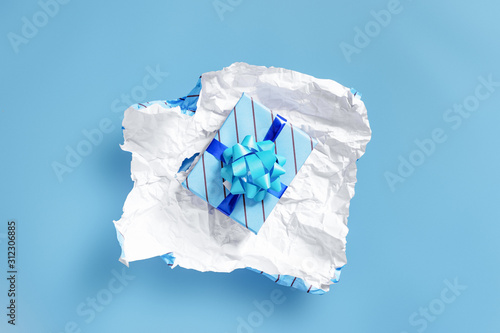 unwrapping present to find another layer of wrapping