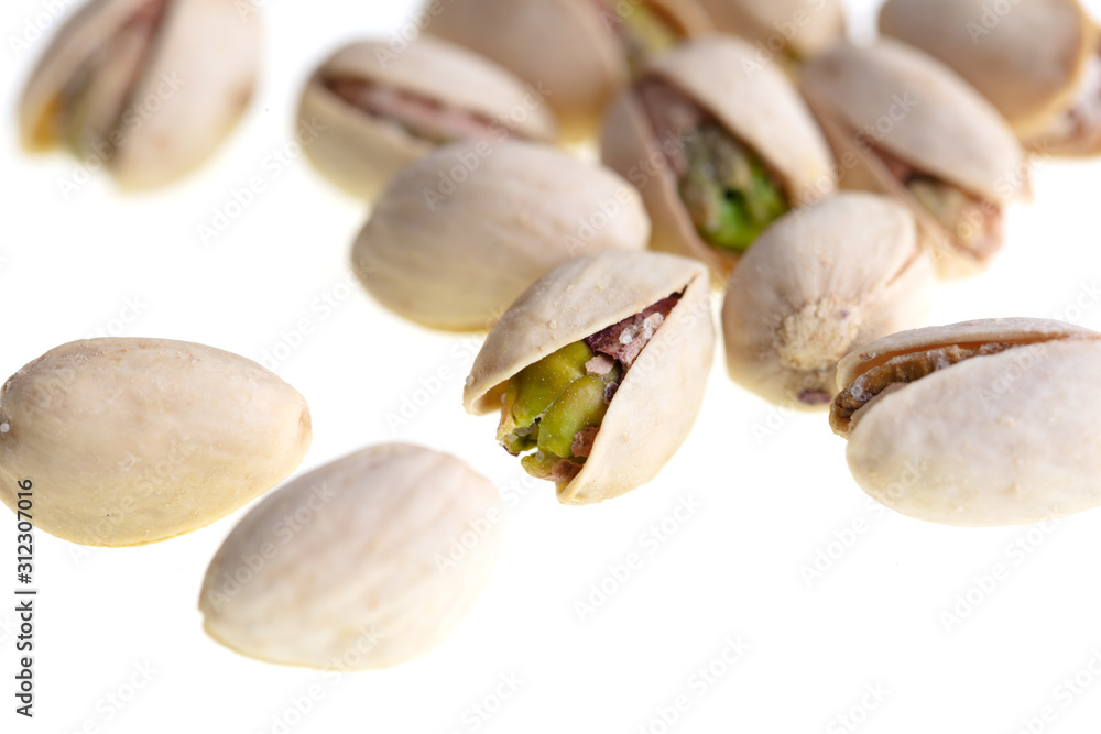 Ripe pistachios nuts isolated on a white background Ripe pistachios nuts isolated on a white background