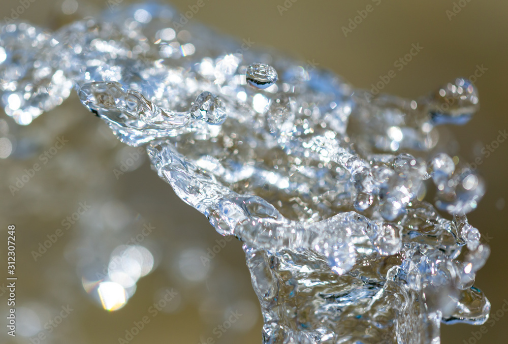 Water splashing from a fountain on summer nature Water splashing from a fountain on summer nature