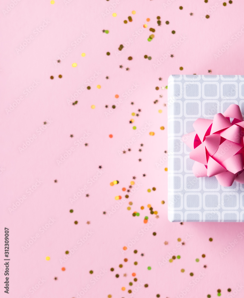 Gift box on pink background.
