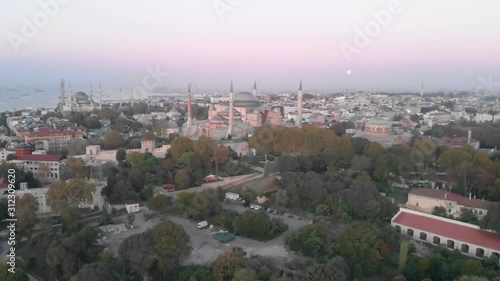 Wallpaper Mural Aerial sunset view of the Istanbul skyline with Hagia Sophia in view. Dome and minarets of former mosque and Christian church now a museum. Drone orbiting. Torontodigital.ca