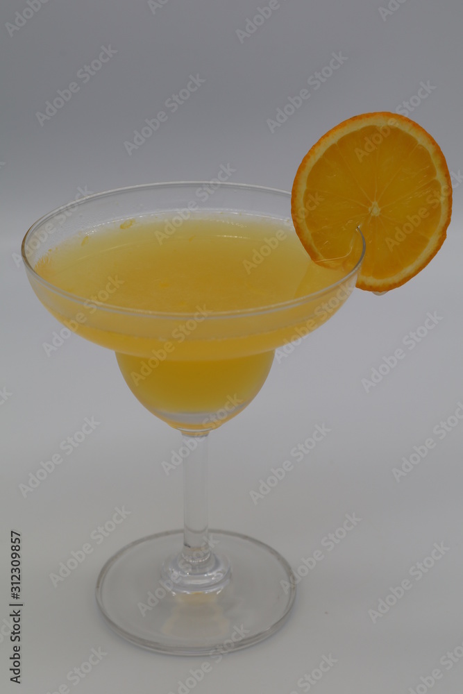 Maitai cocktail in martini glass with orange on top Maitai cocktail in martini glass with orange on top