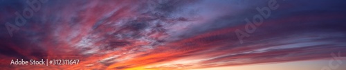 Dramatic Panoramic View of a cloudscape during a dark and colorful sunset. Taken in British Columbia, Canada.