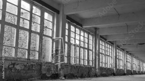 A row of old windows in an abandoned building