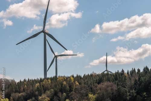 Wind power station - wind turbine against the cloudy sky. Spring Central Sweden.