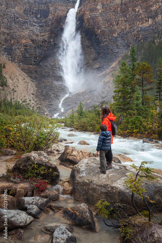 Mother and son hiking near Takakkaw Falls, Yoho National Park, British Columbia.