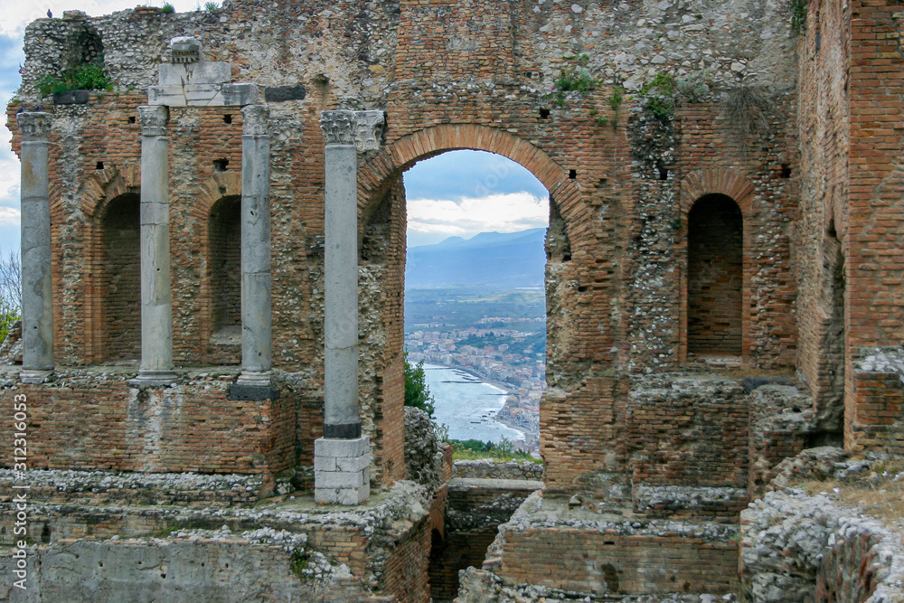 Ruins of ancient Greek theatre in Taormina, Sicily, Italy