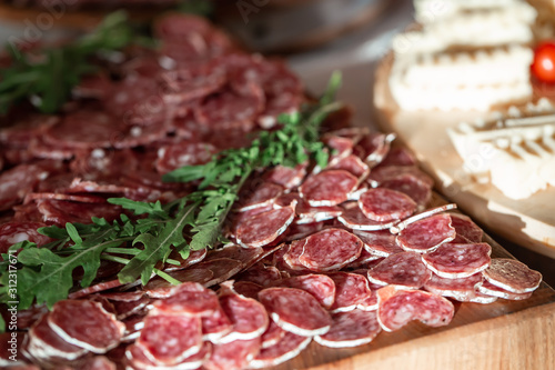 Meat delicacies for the festive table, cold cuts, sausage and salami, cold cuts. buffet table corporate