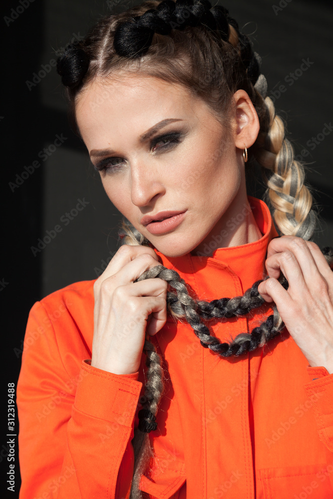 portrait of a beautiful fashionable woman with braids the subculture