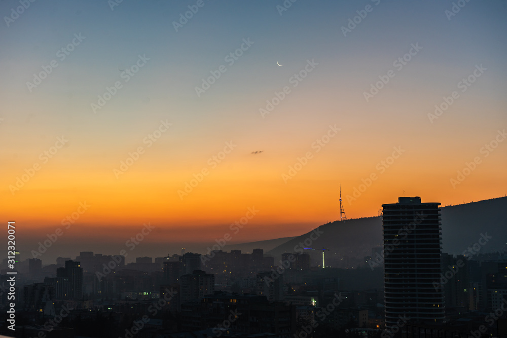 Dramatic sunrise over Tbilisi downtown