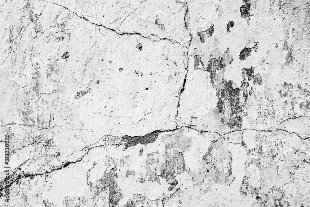 Fototapeta premium Texture of a concrete wall with cracks and scratches which can be used as a background