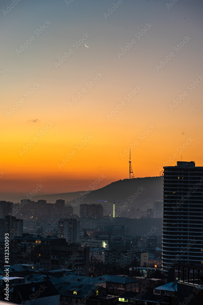 Dramatic sunrise over Tbilisi downtown