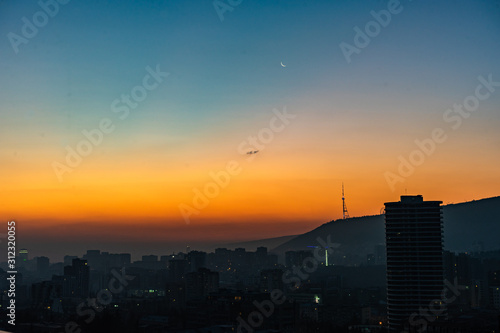Dramatic sunrise over Tbilisi downtown © Anna Bogush
