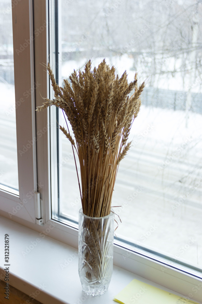 Plakat Wheat ears on the window