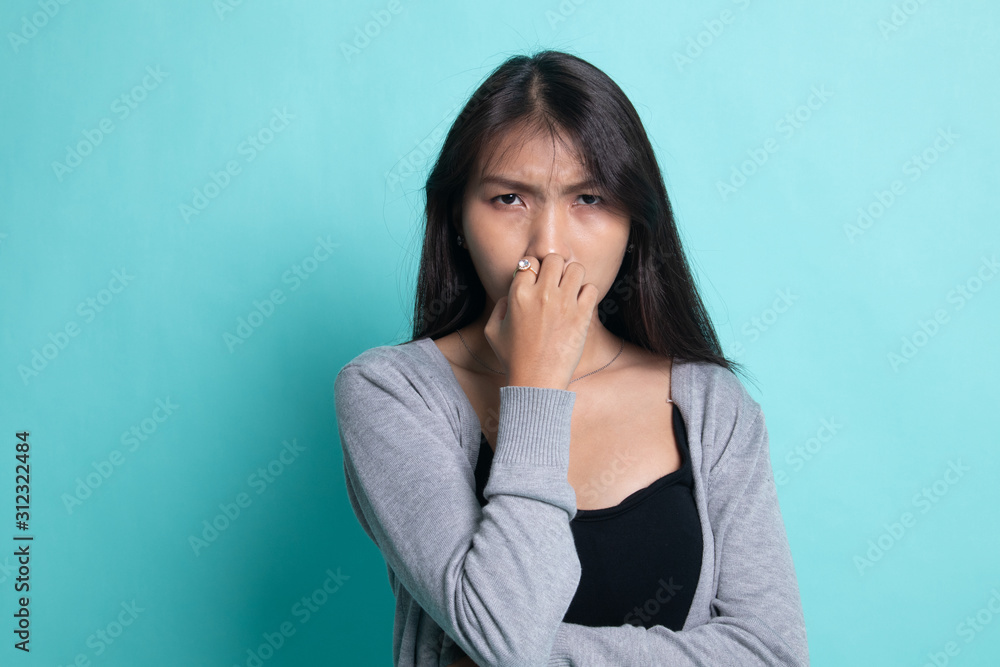 Unsure hesitant nervous young asian woman biting her fingernails. Unsure hesitant nervous young asian woman biting her fingernails.