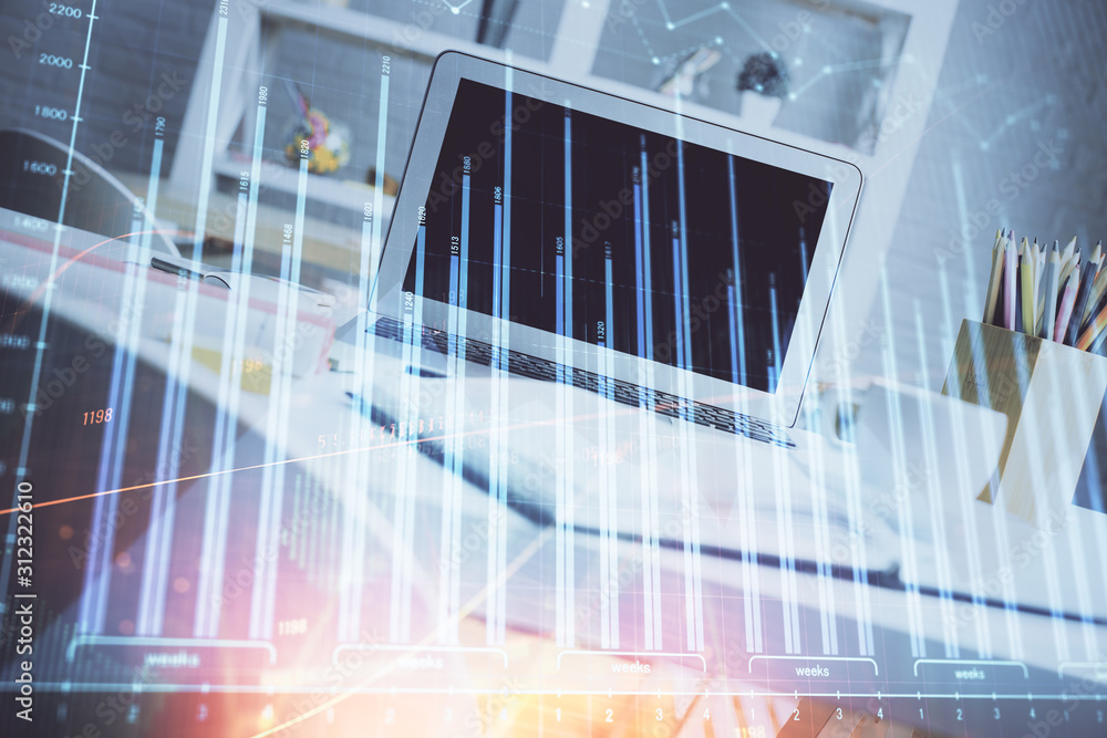 Forex Chart hologram on table with computer background. Double exposure. Concept of financial markets. Forex Chart hologram on table with computer background. Double exposure. Concept of financial markets.