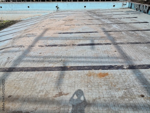 old dirty pool with no water