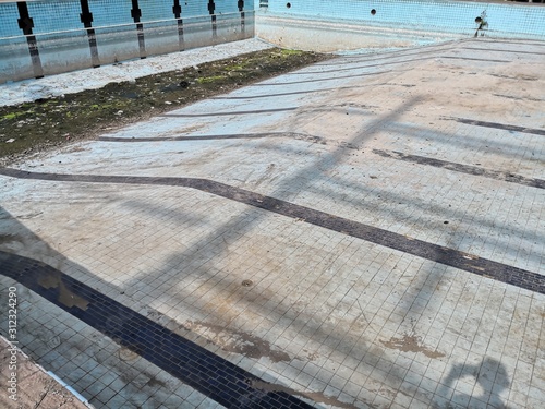 old dirty pool with no water