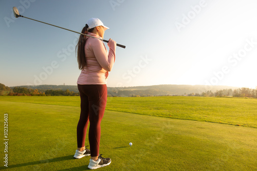 Professional woman golf player ready for competition on the golf