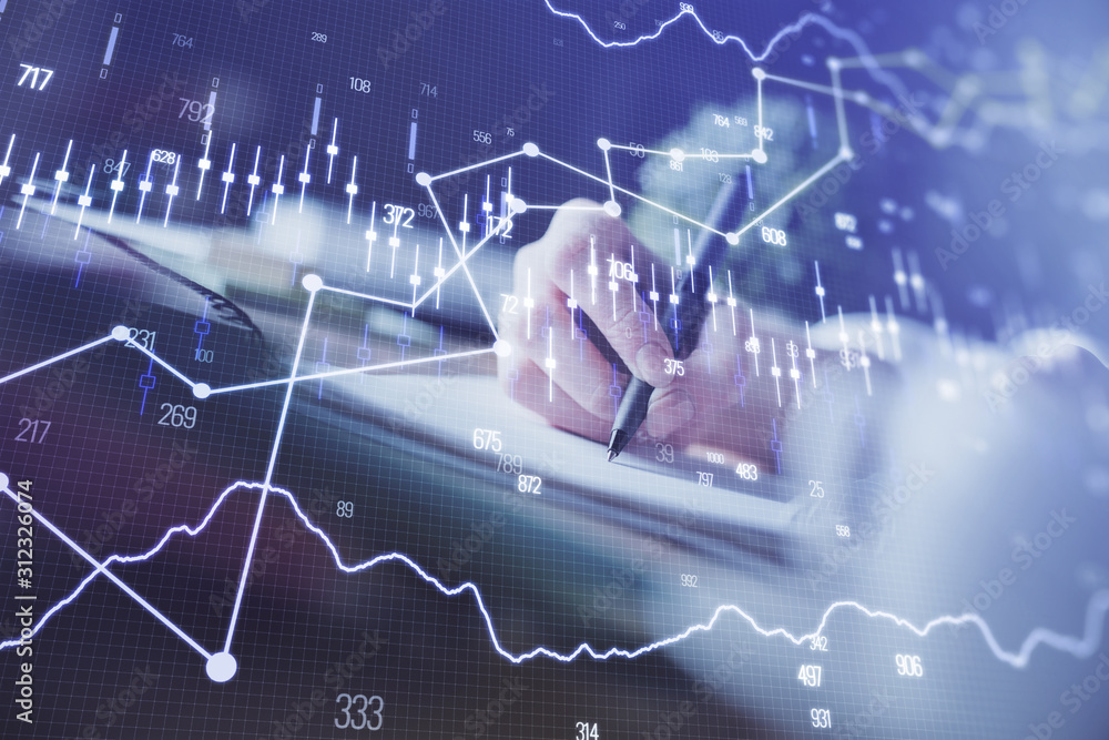 Financial forex graph displayed on hands taking notes background. Concept of research. Multi exposure Financial forex graph displayed on hands taking notes background. Concept of research. Multi exposure