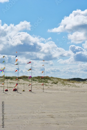 Romo Peninsula - Fantastic beach in denmark with colorful wind chimes. Cloudy summer day photo