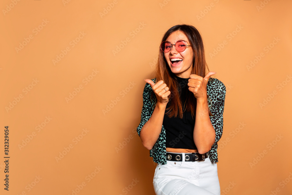 emotional positive young woman laughing sincerel,smiling happy, curly hair, face expression, posing on beige studio background isolated, summer casual style, white teeth, hipster style, super gesture emotional positive young woman laughing sincerel,smiling happy, curly hair, face expression, posing on beige studio background isolated, summer casual style, white teeth, hipster style, super gesture