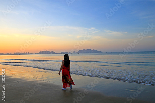Photography A woman by the sea, in southern China