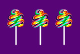 Three colored lollipops side by side in front of violet background.