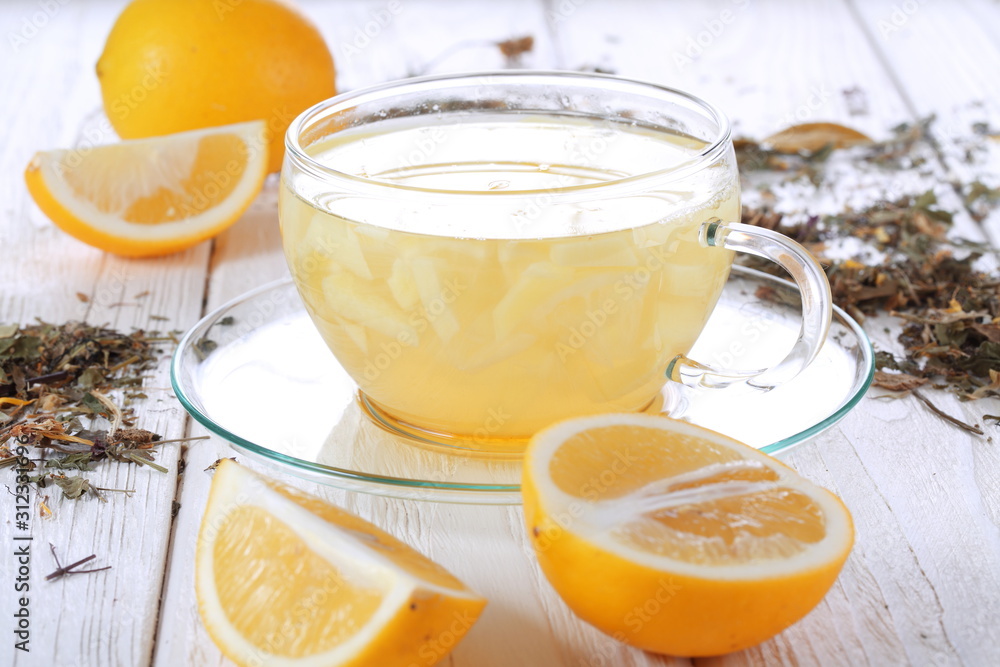 Lemons and lemon drink on a white wooden table Lemons and lemon drink on a white wooden table