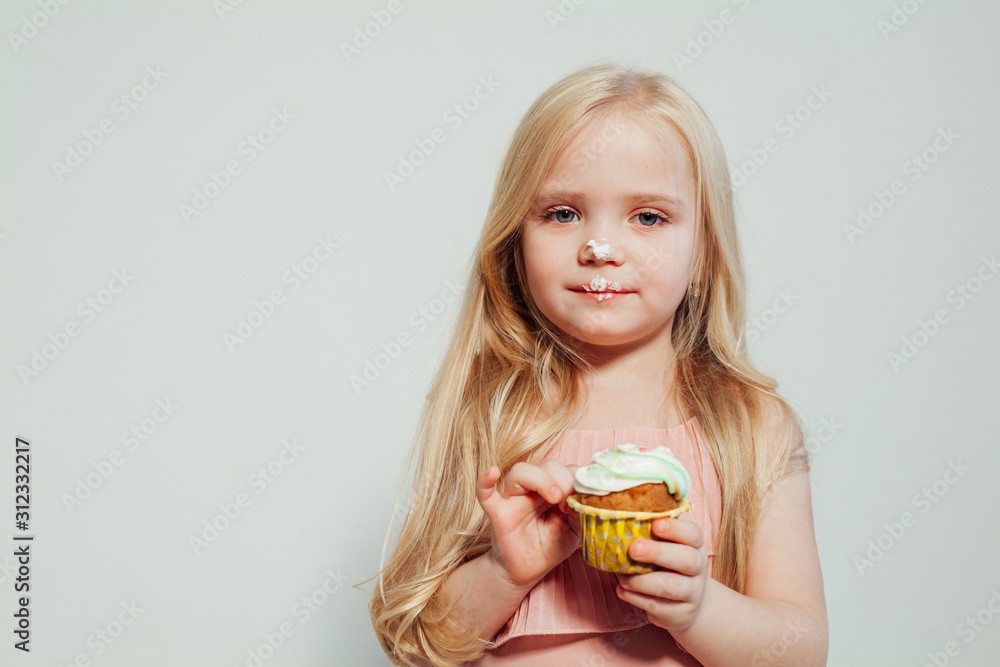 beautiful little girl blonde with cake and candy portrait of food beautiful little girl blonde with cake and candy portrait of food