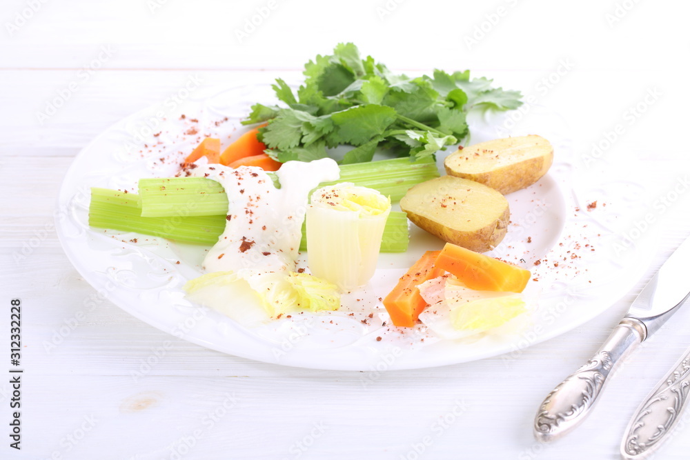 Celery with carrots, potatoes and eggs in white sauce Celery with carrots, potatoes and eggs in white sauce