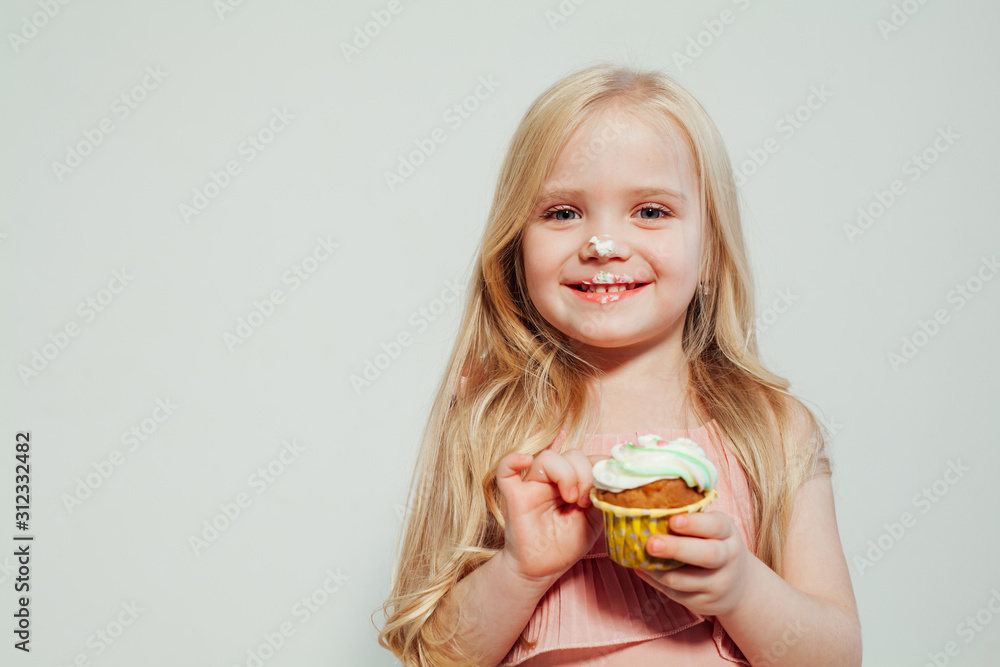 beautiful little girl blonde with cake and candy portrait of food beautiful little girl blonde with cake and candy portrait of food