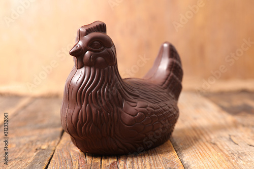 chocolate easter hen on wood background photo