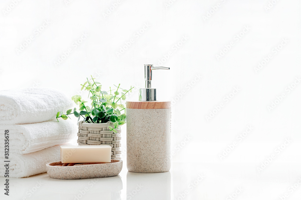Clean soft terry towels with soap on white table, copy space... Clean soft terry towels with soap on white table, copy space...