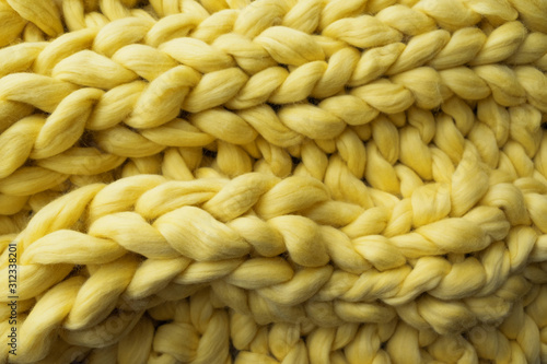 View of the knitted yellow merino wool plaid