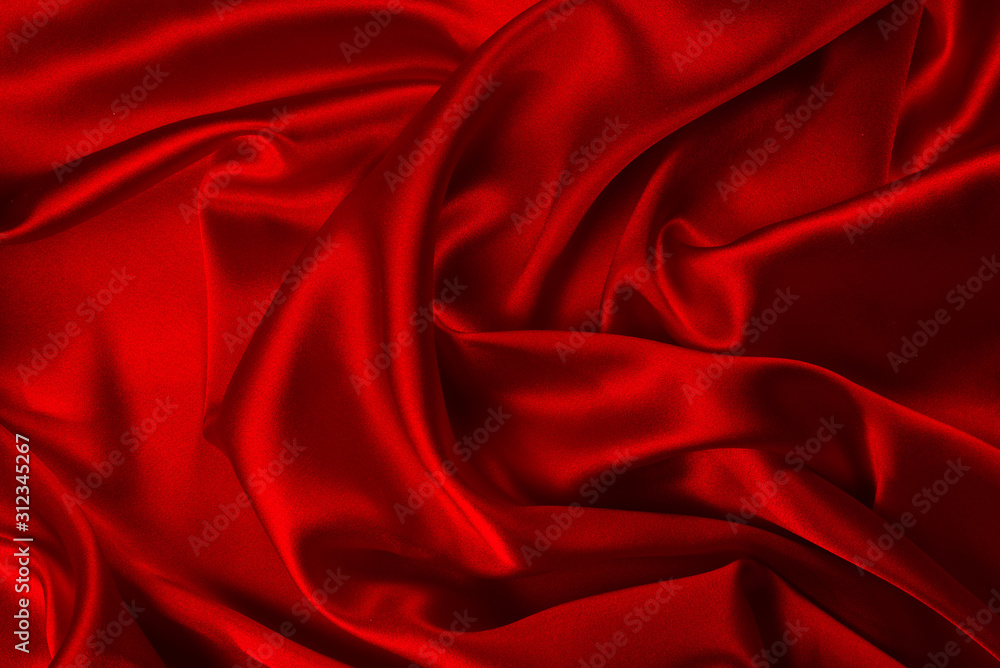 Red silk or satin luxury fabric texture can use as abstract background. Top view. Red silk or satin luxury fabric texture can use as abstract background. Top view.