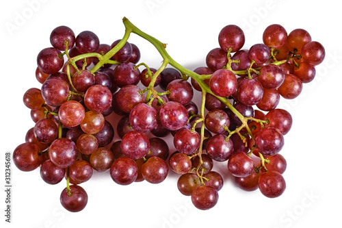 Bunch of fresh raw crimson seedless pink grapes on white background